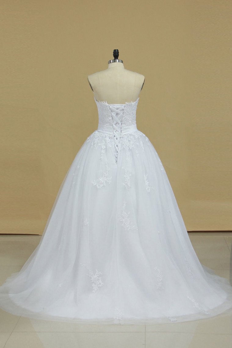2024 New Arrival Strapless With Applique And Sash Tulle Court Train Wedding Dresses